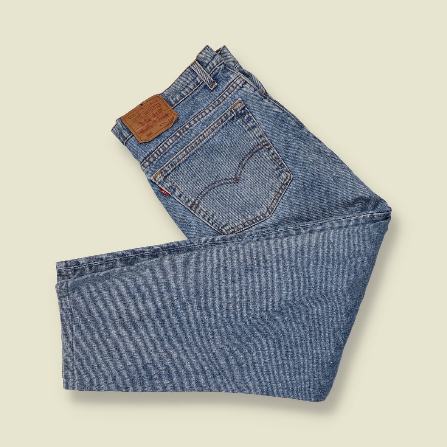 1980s-90s | Levi's | Mid-Wash Blue 550 Relaxed Fit Jeans - Made in USA - w38