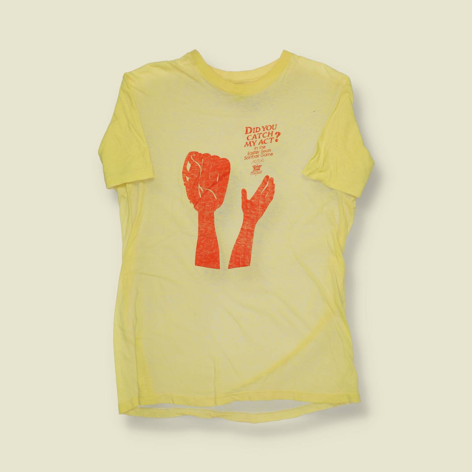 1970s | Hanes | “Did You Catch My Act?” Easter Seals Softball T-Shirt | Yellow – S