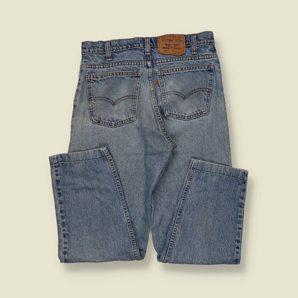 1990s | Levi’s Orange Tab 550 | Made in USA – Light Wash - w26