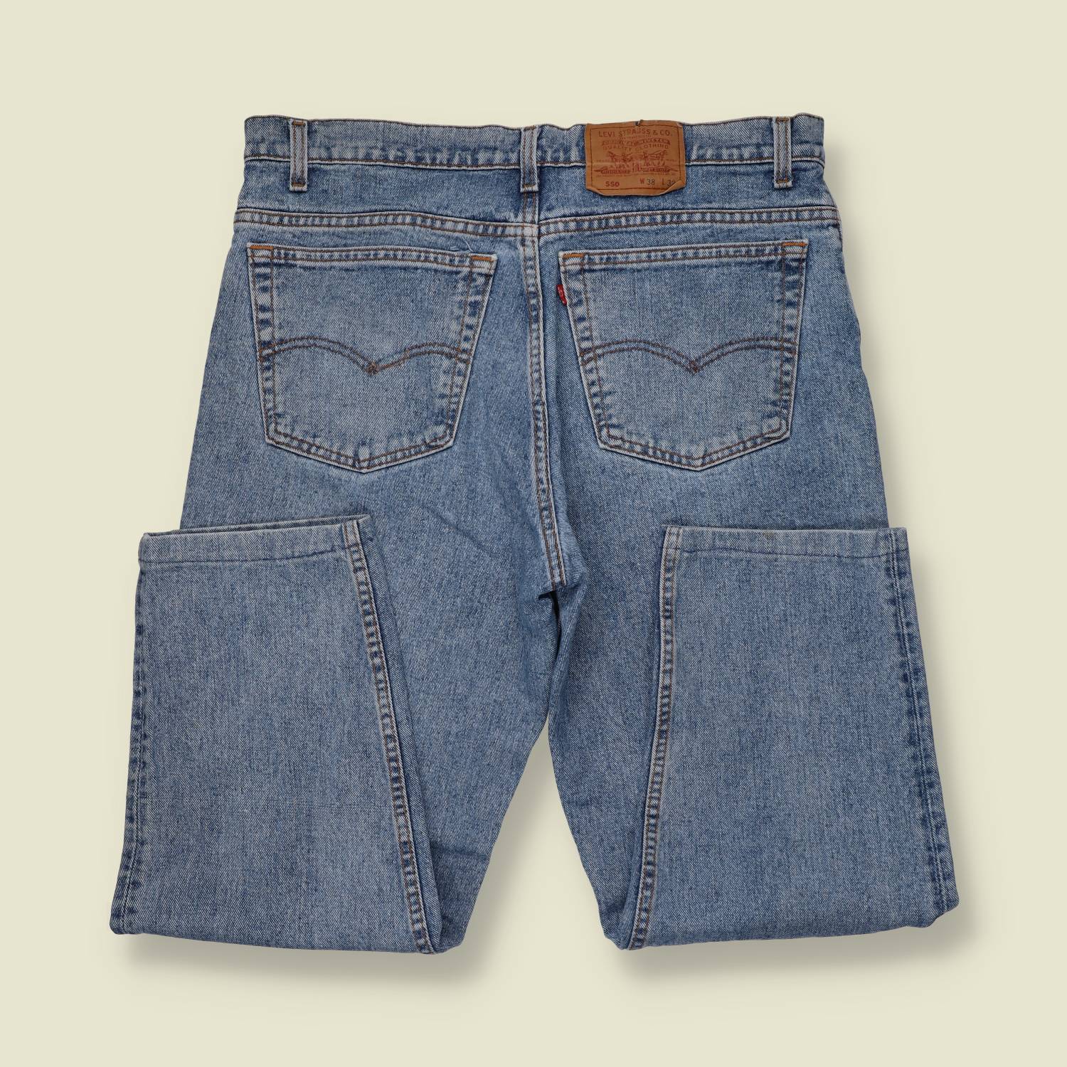 1980s-90s | Levi's | Mid-Wash Blue 550 Relaxed Fit Jeans - Made in USA - w38