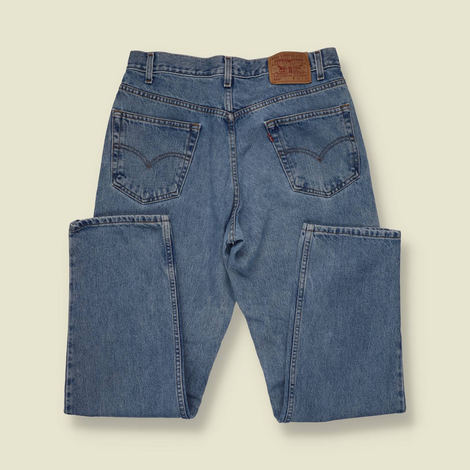 1980s-90s | Levi's | Mid-Wash Blue 550 Relaxed Fit Jeans - Made in Mexico - w34